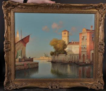 A Venetian canal scene, with figures and boats by 
																			 Vallin