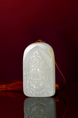 A white jade plaque with immortal pattern by 
																	 Pang Ran