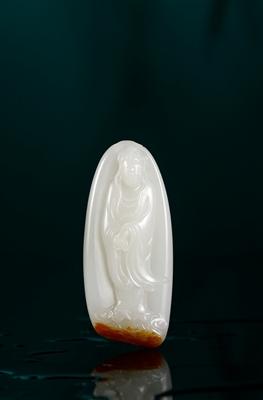 A white jade Guan Yin pendant by 
																	 Xu Zhihao
