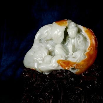 A white jade figure of Guan yin by 
																	 Wang Ping