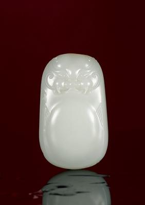 A white jade beast pendant by 
																	 Qian Jianfeng
