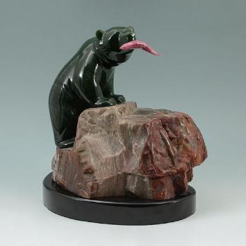 Figure of a bear with pink jade salmon in its mouth by 
																			Lyle Sopel