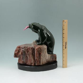 Figure of a bear with pink jade salmon in its mouth by 
																			Lyle Sopel