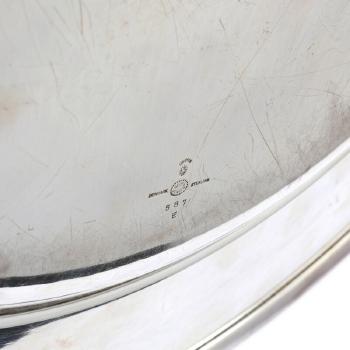 A circular hammered tray by 
																			Johan Rohde