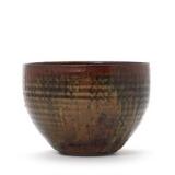 Stoneware bowl Modeled with horizontal grooves, decorated with brown, black and yellowish green glaze by 
																			Gutte Eriksen