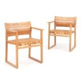 A pair of armchairs of oak  by 
																			 P Lauritsen & Sons