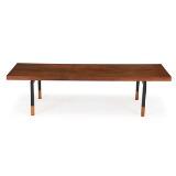 A rectangular coffee table with black lacquered metal frame, rosewood top and shoes by 
																			Johannes Aasbjerg