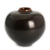 A Royal Copenhagen stoneware vase with broad shoulders, decorated in dark brown glaze with line pattern by 
																			Gerd Bogelund