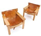 A pair of solid pine easy chairs by 
																			Karin Mobring