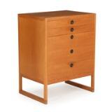 An oak chest of drawers by 
																			 P Lauritsen & Sons