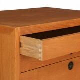 An oak chest of drawers by 
																			 P Lauritsen & Sons