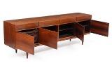 Rosewood sideboard, front with four drawers and four doors, inside with shelves and trays, brass hinges by 
																			 Faarup Mobelfabrik
