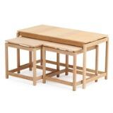 One large and two smaller solid oak nesting tables by 
																			 K P Mobler