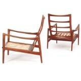 A pair of easy chairs with teak frame by 
																			 Olof Perrson Mobler