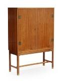 A rosewood cabinet, front with two doors behind which pull out trays by 
																			Harbo Solvsten