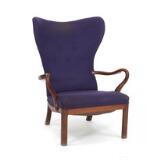 Easy chair with curved armests and frame of Cuban mahogany by 
																			 Worts Mobler