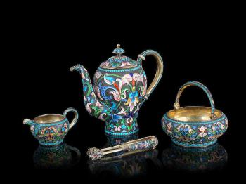 A silver-gilt and enamel tea set by 
																			Ivan Saltykov