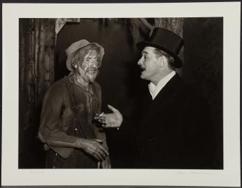 Rich Man - Poor Man, Times Square, New York (1); Young Couple, Times Square, New York (2) by 
																			Lou Stoumen