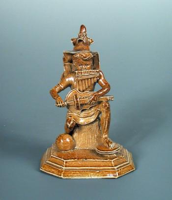  A Rare Stoneware One Man Band Figure
 by 
																			George Tinworth