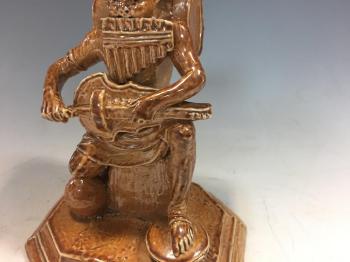  A Rare Stoneware One Man Band Figure
 by 
																			George Tinworth