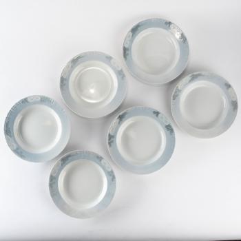 Six 'Marguerites' soup plates by 
																			Arnold Krog