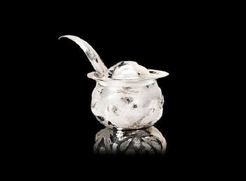 A silver mustard pot and spoon by 
																			Ndidi Ekubia