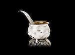 A silver mustard pot and spoon by 
																			Ndidi Ekubia