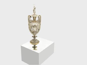 An impressive Victorian parcel-gilt silver cup and cover by 
																			 Hancocks & Co.