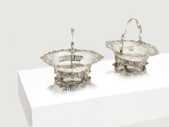 A pair of George II silver baskets by 
																	 Samuel Herbert & Co.