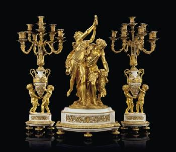 A Napoleon III Ormolu and White Marble Three-Piece Garniture by 
																	Raingo Freres