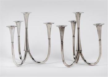 A pair of four-armed candelabra by 
																	Wilhelm Wagenfeld