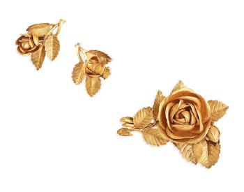 A Flower Brooch And Earclip Suite by 
																	Bernard Instone