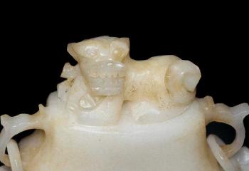 A White Jade Flask with Taotie Masks by 
																			 Han Dynasty