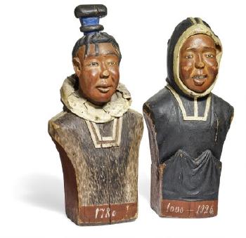 A pair of Greenlandic paint wood busts depicting an Inuit man and woman in traditional clothes by 
																	Gerth Lyberth