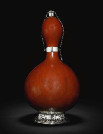 A Victorian silver mounted gourd bottle by 
																	 Rawlings & Summers