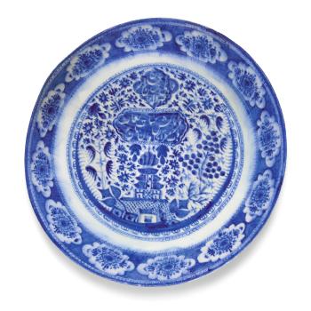 A Qajar blue and white pottery dish, Persia by 
																	 Muhammad