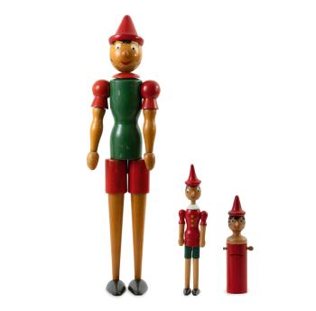 Three wooden Pinocchio dolls by 
																	 C2