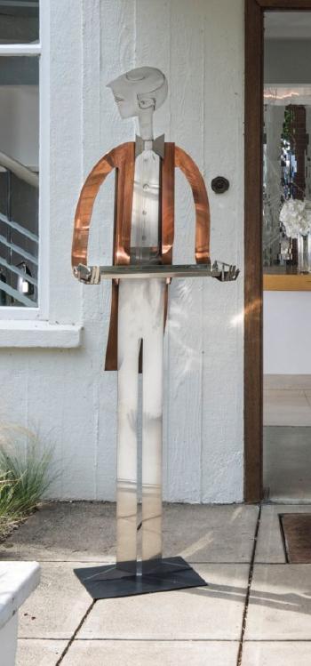 A life-size figure of a butler by 
																	 Hagenauer Werkstatte