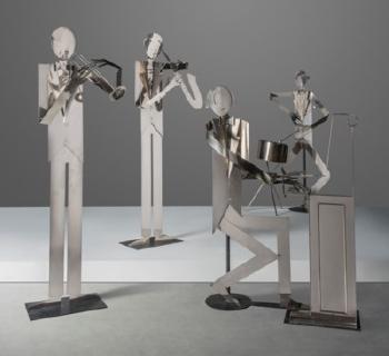 A rare group of four life-size musicians by 
																	 Hagenauer Werkstatte