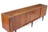 Rosewood sideboard, front with four sliding doors behind which adjustable shelves and trays by 
																			Henry Rosengren Hansen