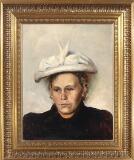 Portrait of woman with an elegant hat by 
																			Peter Vilhelm Ilsted