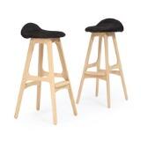 A pair of oak bar stools by 
																			Erik Buck