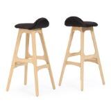 A pair of oak bar stools by 
																			Erik Buck