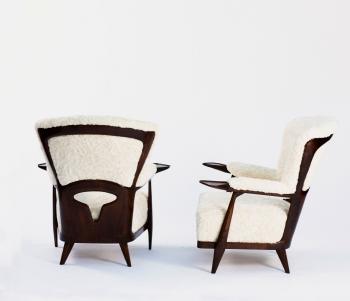 Two lounge chairs by 
																			Enrico Chuti