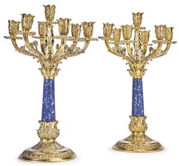 A pair of English silver-gilt and lapis lazuli seven-light candelabra by 
																	 Asprey & Co.
