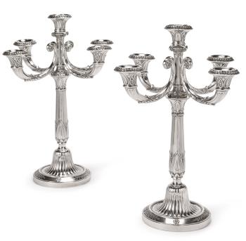 A pair of French silver five-light candelabra by 
																	 Tetard Freres