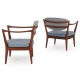 A pair of easy chairs of mahogany by 
																			Fredrik A Kayser