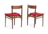 A pair of rosewood side chairs, seats with red wool by 
																			Henry Rosengren Hansen
