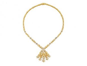 A Diamond and Gold Necklace by 
																	 Fred