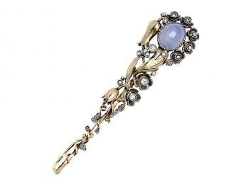 An Arts and Crafts Star Sapphire and Diamond Floral Brooch by 
																	Anni Hystak